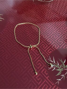 Adjustable Gold-Tone Slide Bracelet *has flaw*